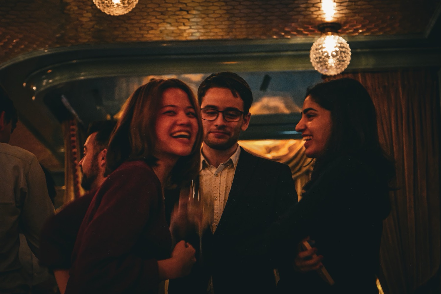 Guests laughing at a London launch event